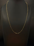 14K yellow gold snake chain measuring 18 inches long and approximately 1mm wide, weighing 7.4 grams, displayed on a black jewelry bust.