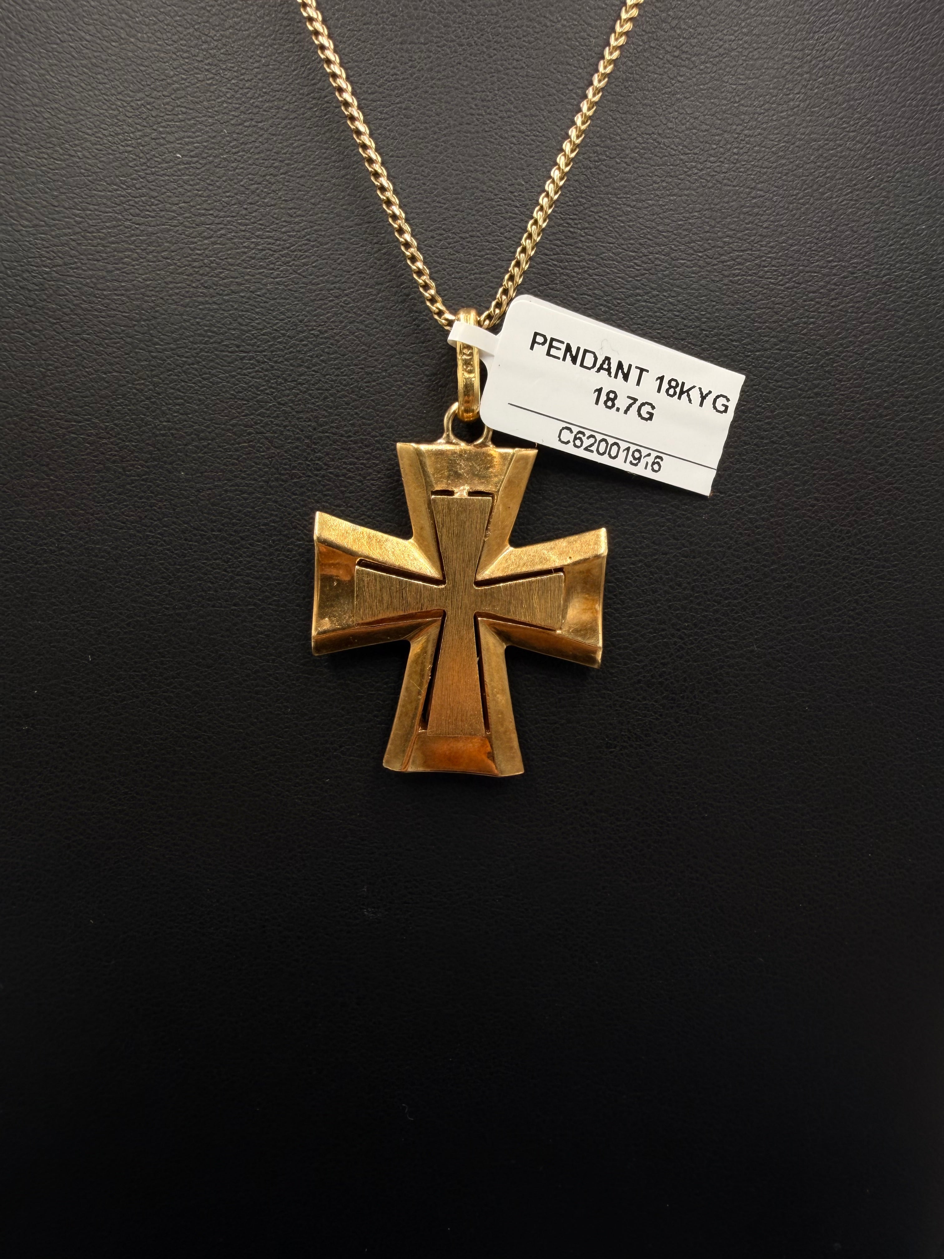 Reverse of 18K yellow gold flared cross pendant with store tag showing 18.7 grams