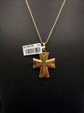 Front of 18K yellow gold flared cross pendant on a gold chain